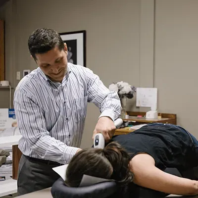 Chiropractor in Mountain Brook, AL, Performing a Chiropractic Adjustment on a Patient.