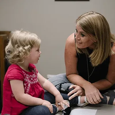 Chiropractor Dr. Lori Hassig With Pediatric Patient in Mountain Brook, AL.